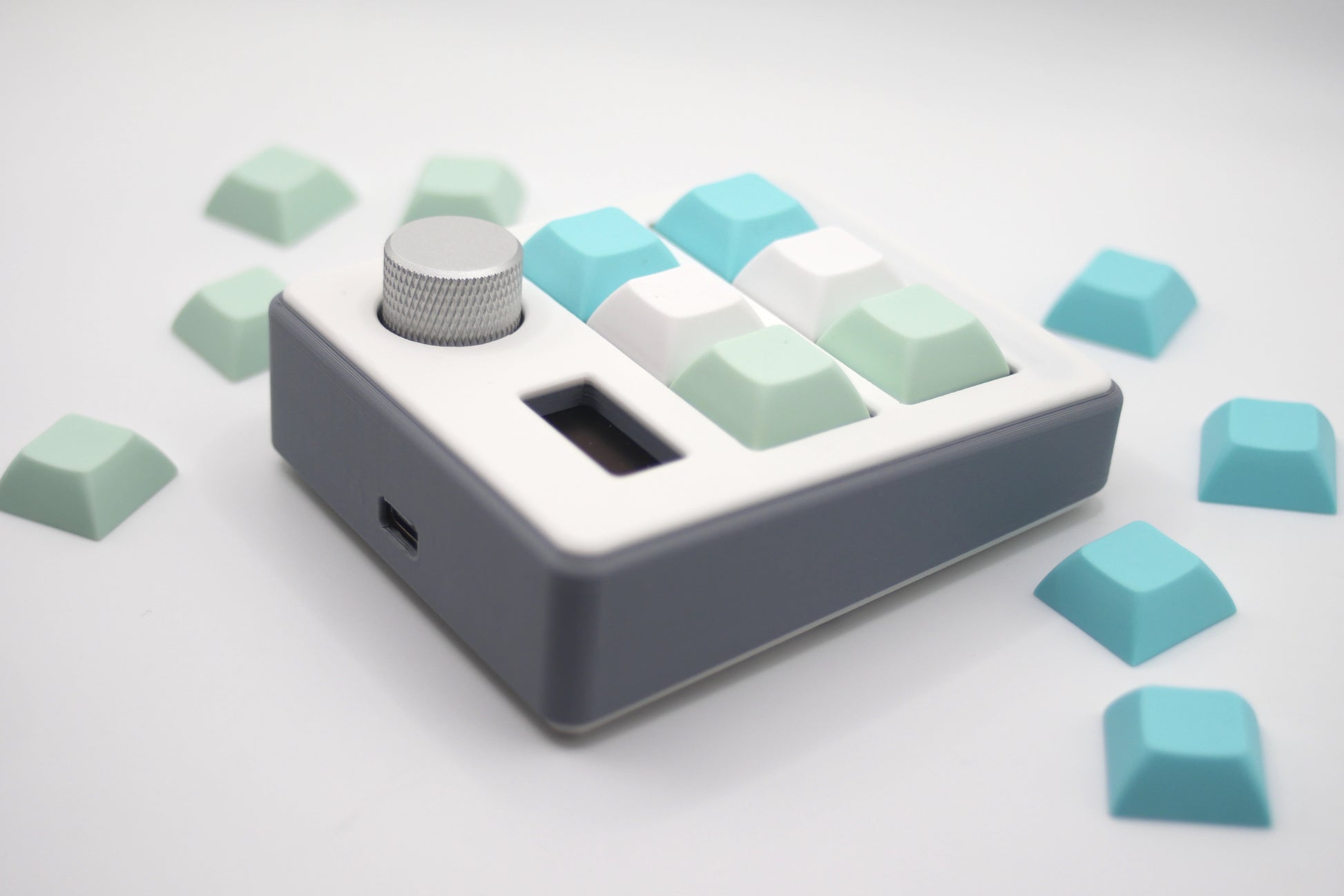 TogKey Pad Plus gray macropad with six pastel keycaps and silver rotary knob
