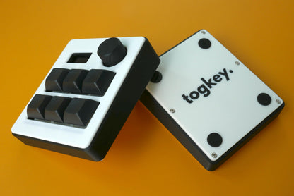 Togkey programmable macropad front and bottom view showing black and white 3d-printed case rubber feet and encoder knob
