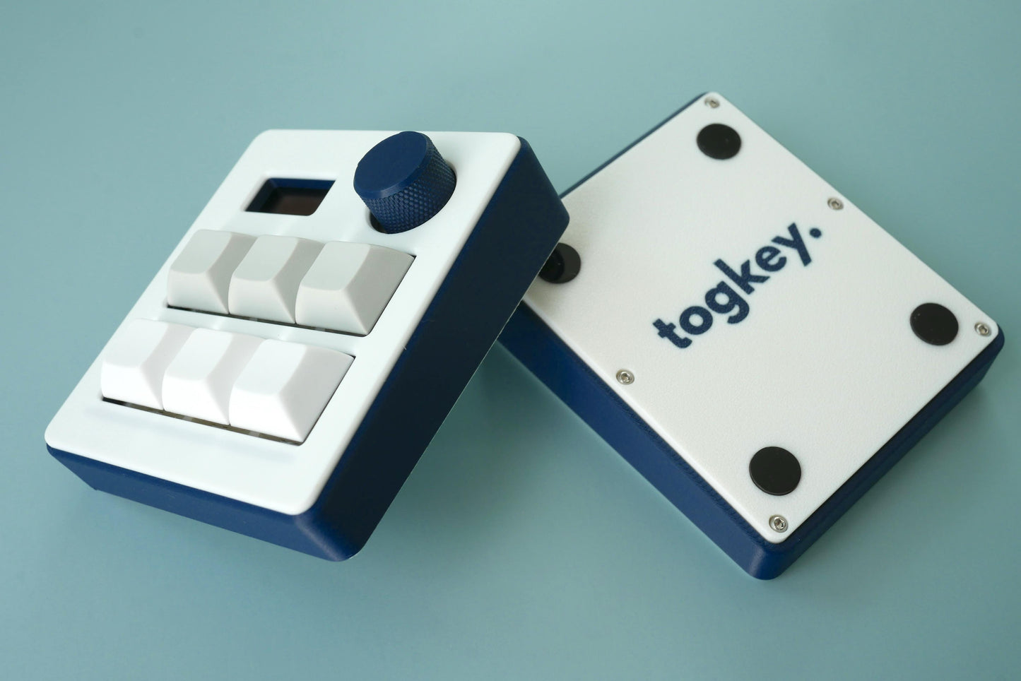 Togkey programmable macropad front and bottom view showing 3d-printed case rubber feet and encoder knob