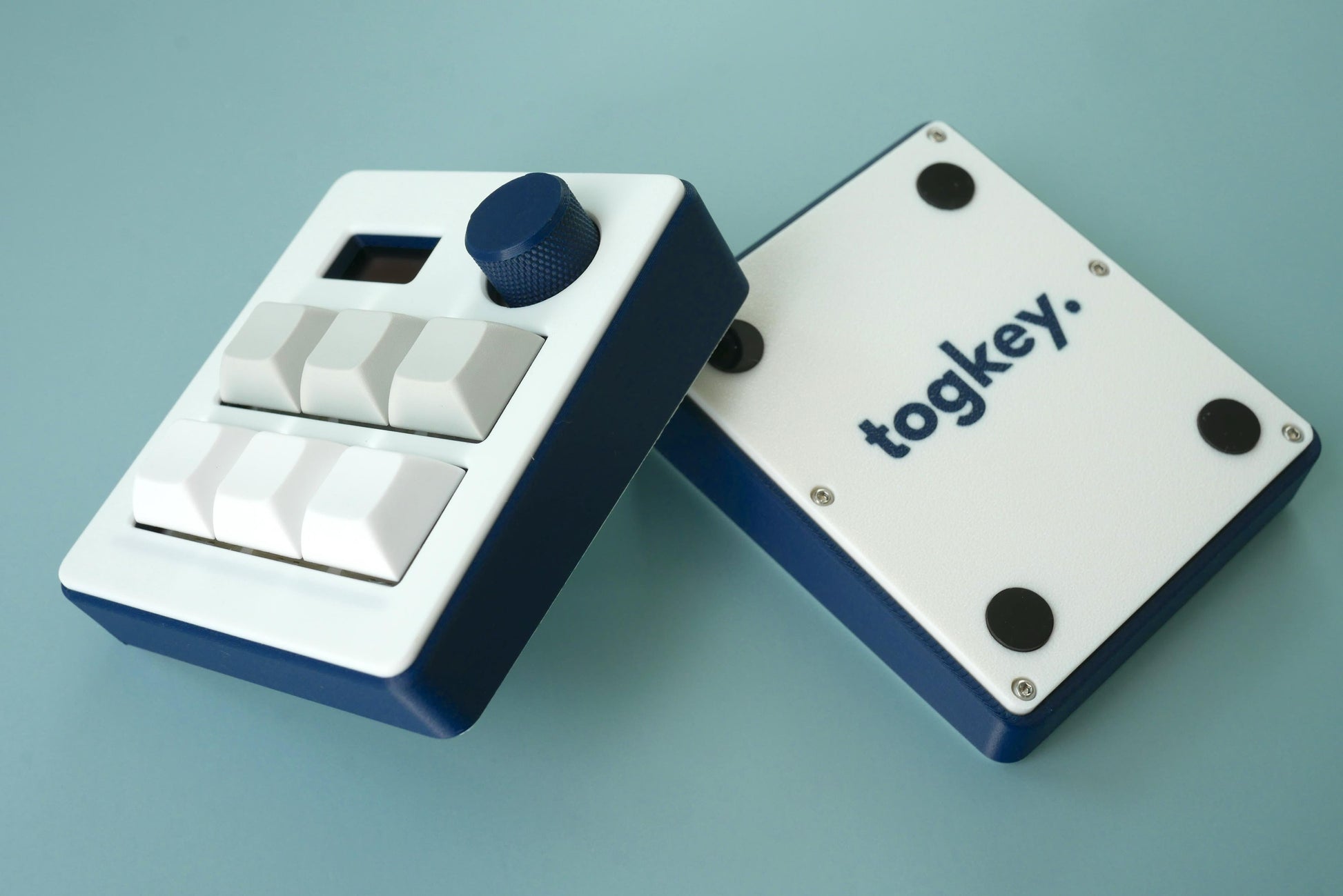 Togkey programmable macropad front and bottom view showing 3d-printed case rubber feet and encoder knob