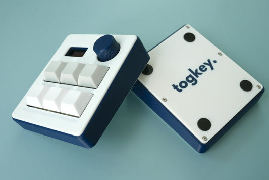 Togkey programmable macropad front and bottom view showing 3d-printed case rubber feet and encoder knob