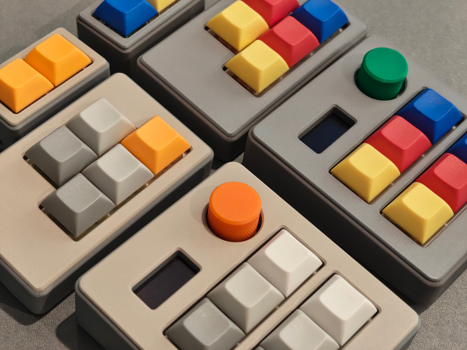 Close-up of colorful keyboard keycaps on a gray surface